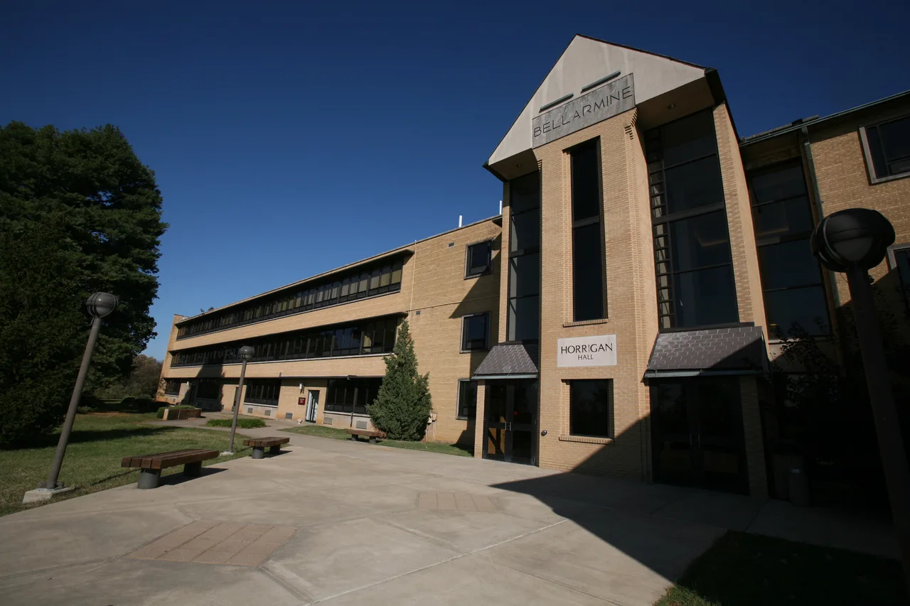 Horrigan Hall at Bellarmine University, with its university and building signs.