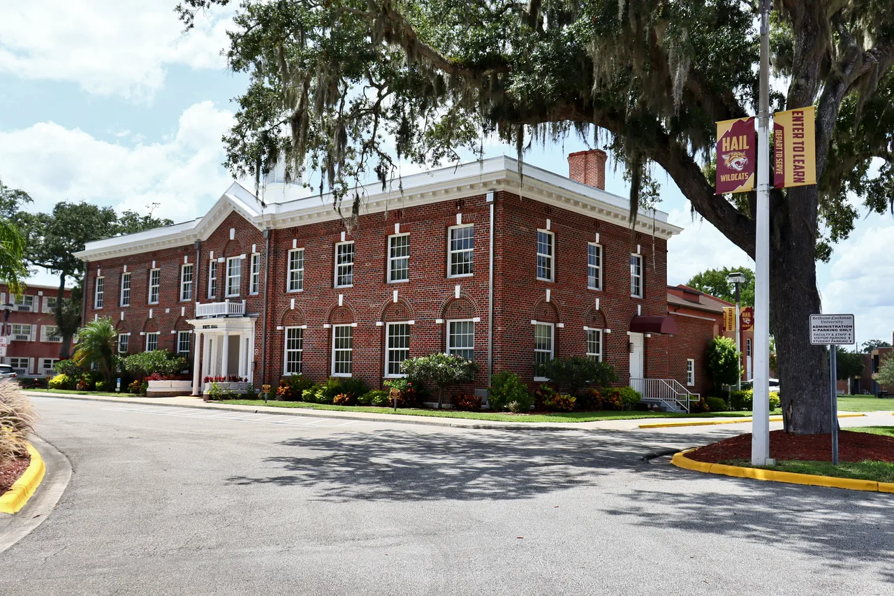 White Hall at Bethune–Cookman University, framed by campus trees.