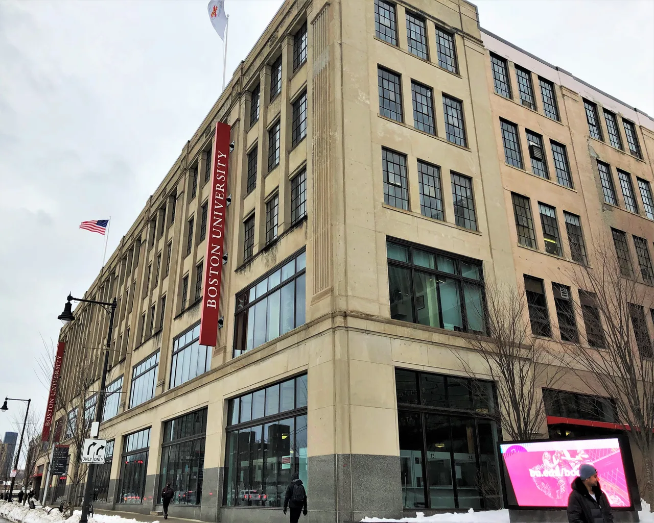 Boston University’s Peter Fuller Building with university banners on Commonwealth Avenue.