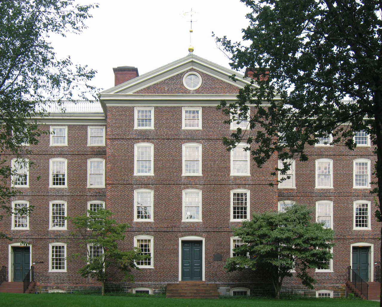 The brick facade and front lawn of University Hall at Brown University.