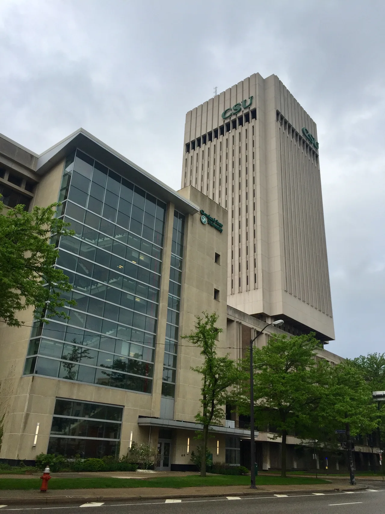 Rhodes Tower and an adjoining glass-fronted building at Cleveland State University.