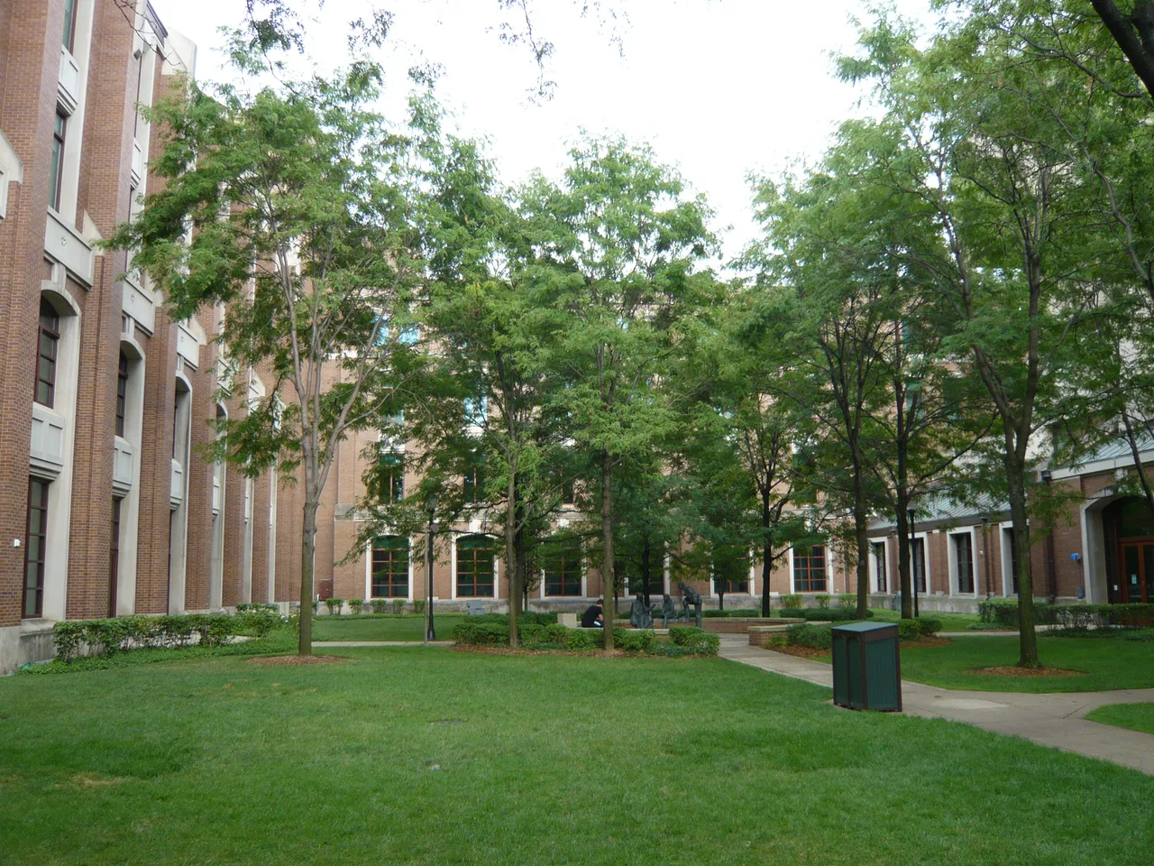 Brick campus buildings, trees, lawn and walking paths at DePaul University’s Lincoln Park campus in Chicago.