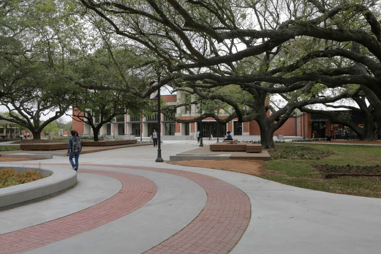 Tree-lined paths and the exterior of Setzer Student Center at Lamar University in Beaumont, Texas.