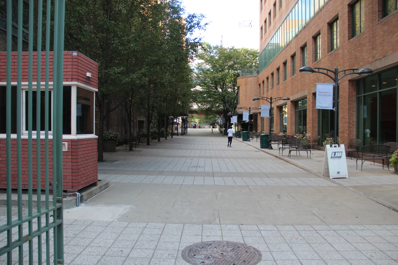 Pedestrian path, brick campus buildings and LIU signage at Long Island University’s Brooklyn campus in New York