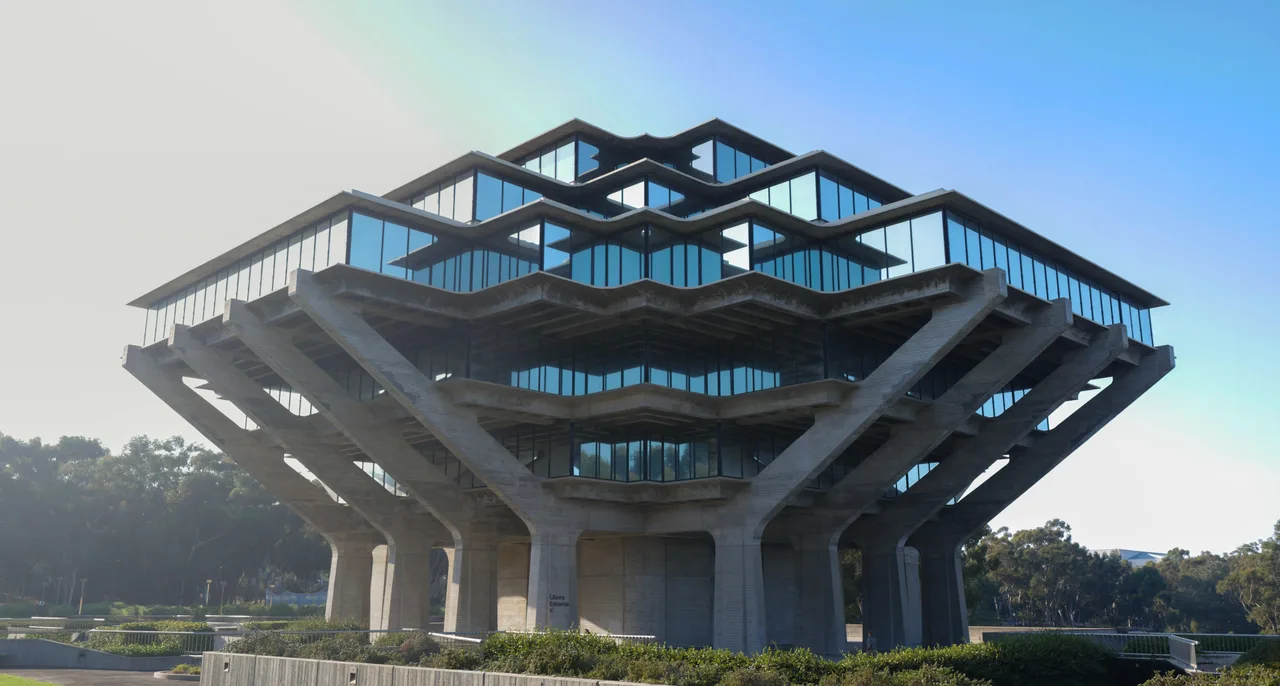 Geisel Library with tiered glass floors, concrete supports and surrounding landscaping at UC San Diego.
