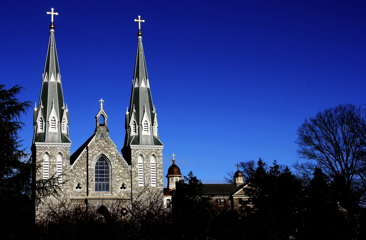 Twin church spires and a stone facade on Villanova University’s campus.